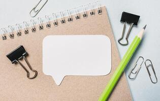 Notepad, white sticker and pensil on the desk. Mock up in copy space office background. It is important not to forget the note photo