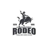 cowboy riding a raging bull rodeo silhouette logo graphic vector