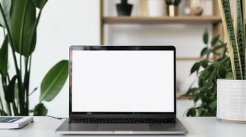 Mockup image of laptop with blank white screen on white table. photo