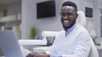 Portrait of african american male dentist sitting in his office. photo