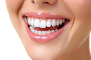 Close up of a happy woman's mouth with healthy teeth isolated on a white background photo