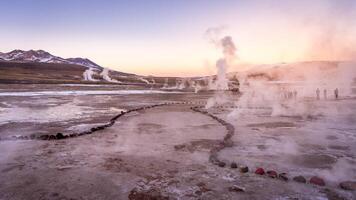 Sunrise at Geyser El Tatio, San Pedro de Atacama, Chile. photo