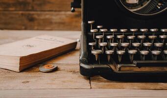 A vintage typewriter with a rubber and an old book. photo