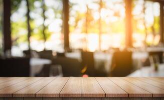 Empty wooden table top with lights bokeh on blur restaurant background photo