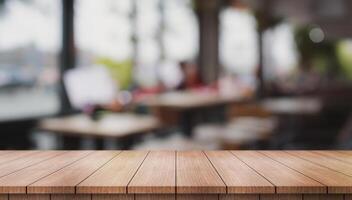 Empty wooden table top with lights bokeh on blur restaurant background. photo