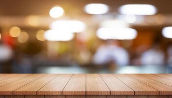 Empty wooden table top with lights bokeh on blur restaurant background. photo