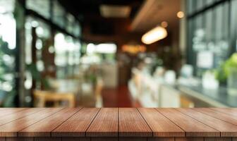 Empty wooden table top with lights bokeh on blur restaurant background photo