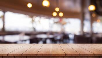 Empty wooden table top with lights bokeh on blur restaurant background. photo