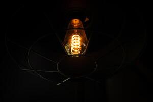 Vintage lamp on black background. photo