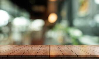 Empty wooden table top with lights bokeh on blur restaurant background photo