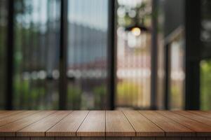 Empty wooden table top with lights bokeh on blur restaurant background. photo