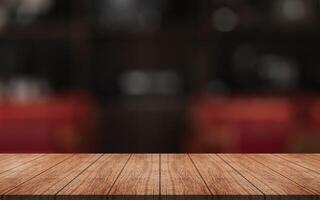 Empty wooden table top with lights bokeh on blur restaurant background. photo