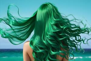 mermaid girl with long green hair near sea back view photo