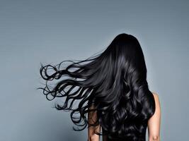 back view brunette with long curly flowing hair photo