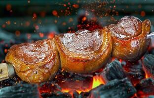 Steak rotisserie at the steakhouse, sliced picanha, Picanha photo