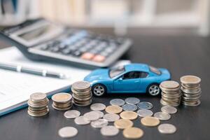 Business concept involved using finance calculator to determine premium for vehicle policy, ensuring clear financial contract for car. Investing in auto insurance can save money on transport costs. photo