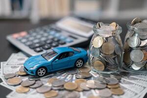 Business concept involved using finance calculator to determine premium for vehicle policy, ensuring clear financial contract for car. Investing in auto insurance can save money on transport costs. photo