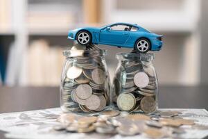 Business concept involved using finance calculator to determine premium for vehicle policy, ensuring clear financial contract for car. Investing in auto insurance can save money on transport costs. photo