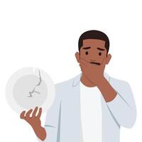 Young scared man hands holding a broken white plate. vector