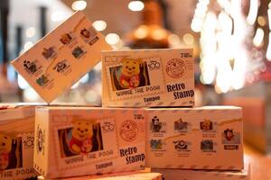 Bangkok, Thailand - May 10, 2024 Set box of Disney 100th Anniversary Retro Stamp from MINISO photo