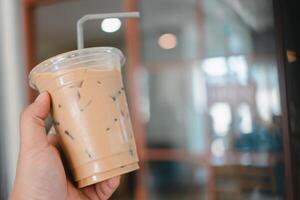 Iced coffee in disposable to go cup photo