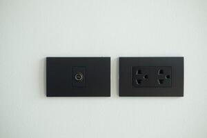 Black electrical outlet and inserts the antenna cable to the TV outlet photo