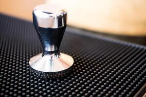 Close up of coffee tamper photo