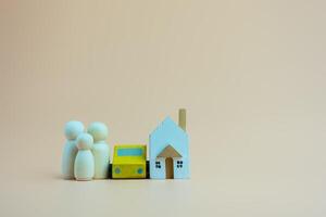 Wooden family doll human with house and car, couple relationship symbol. Insurance and property investment. photo