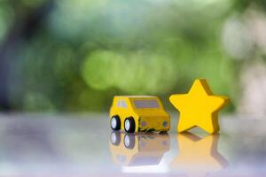 Wood car and wood star for scoring satisfaction surveys photo