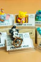 Bangkok, Thailand - May 1, 2024 Steamboat willie, Figure of MINISO Disney 100 Years of Wonder Retro Stamp Series Blind Box Figure photo