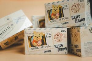 Bangkok, Thailand - May 25, 2024 Box of Disney 100th Anniversary Retro Stamp from MINISO photo