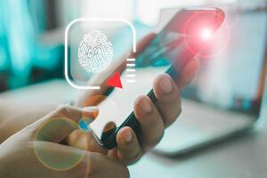 Hand holding smartphone and scan fingerprint biometric identity for unlock mobile phone photo