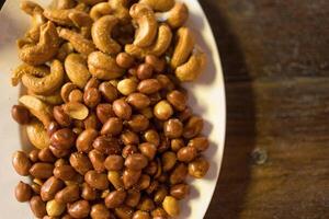 Peanuts and cashews, snacks at pub. photo