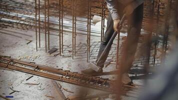 worker at a construction site works with a large sledgehammer video