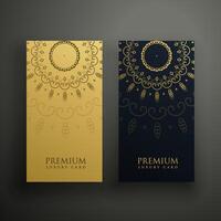 luxury mandala card design in gold and black color vector