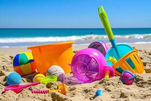 Children's toys lie on the sand. Small sea waves are visible in the background. Summer rest photo