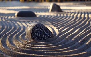 The atmosphere of meditation and tranquility is conveyed by the waves on the sand and zen stones. photo