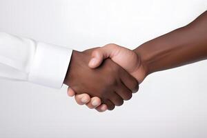 Close-up handshake between two races. No to racism photo