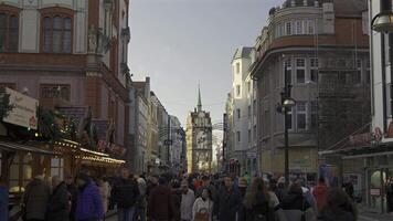 December 29, 2023. Rostock, Germany. Kropeliner Tor der Rostocker Stadtbefestigung. Historic Kropeliner gate on downtown shopping street in city Rostock in sunny winter weather. Kropeliner Strasse video