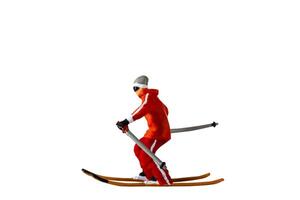 Miniature people , A skier full length Isolated with clipping path photo