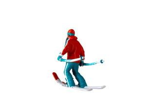 Miniature people , A skier full length Isolated with clipping path photo