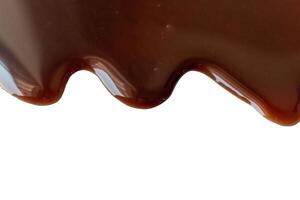 Liquid Chocolate Cream isolated on white background with clipping path photo