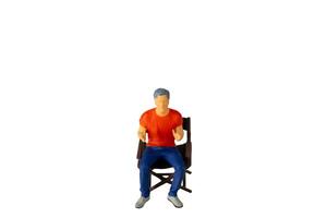 A Young man seated on a chair isolated on white background with clipping path photo