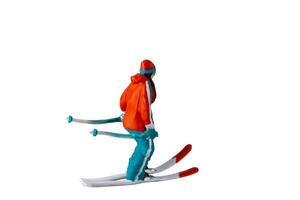 Miniature people , A skier full length Isolated with clipping path photo