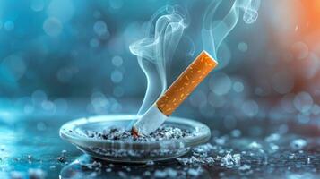 Smoldering cigarette on ashtray amidst soft blue hazy backdrop. photo