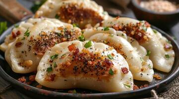 Homemade vareniki, pirogi sprinkled with fried bacon. photo
