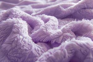 Purple delicate background of nice furry cloth. Soft loose folds on the fabric of faux fur of blue classic color as textured background. photo