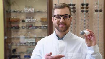 Ophthalmologist hold contact lenses in hands. Eyesight correction. Ophthalmology, excellent vision or optician shop concept. Laser surgery alternative video