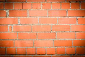 Old and aged red brick wall texture background with vignetting 1 photo