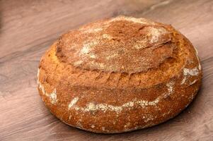 appetizing homemade whole grain bread on a wooden table 5 photo